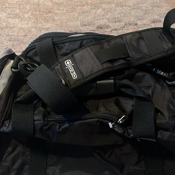 New OGIO sports illustrated black and gray duffle bag with shoulder strap.